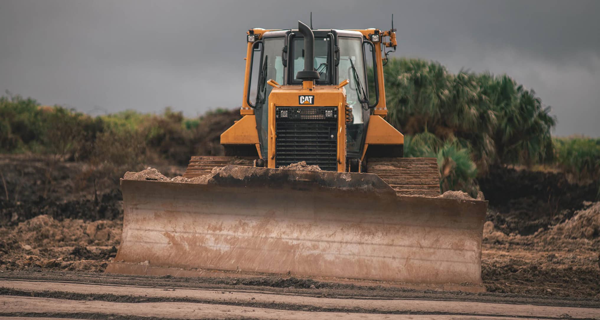 Tractor lifting mud
