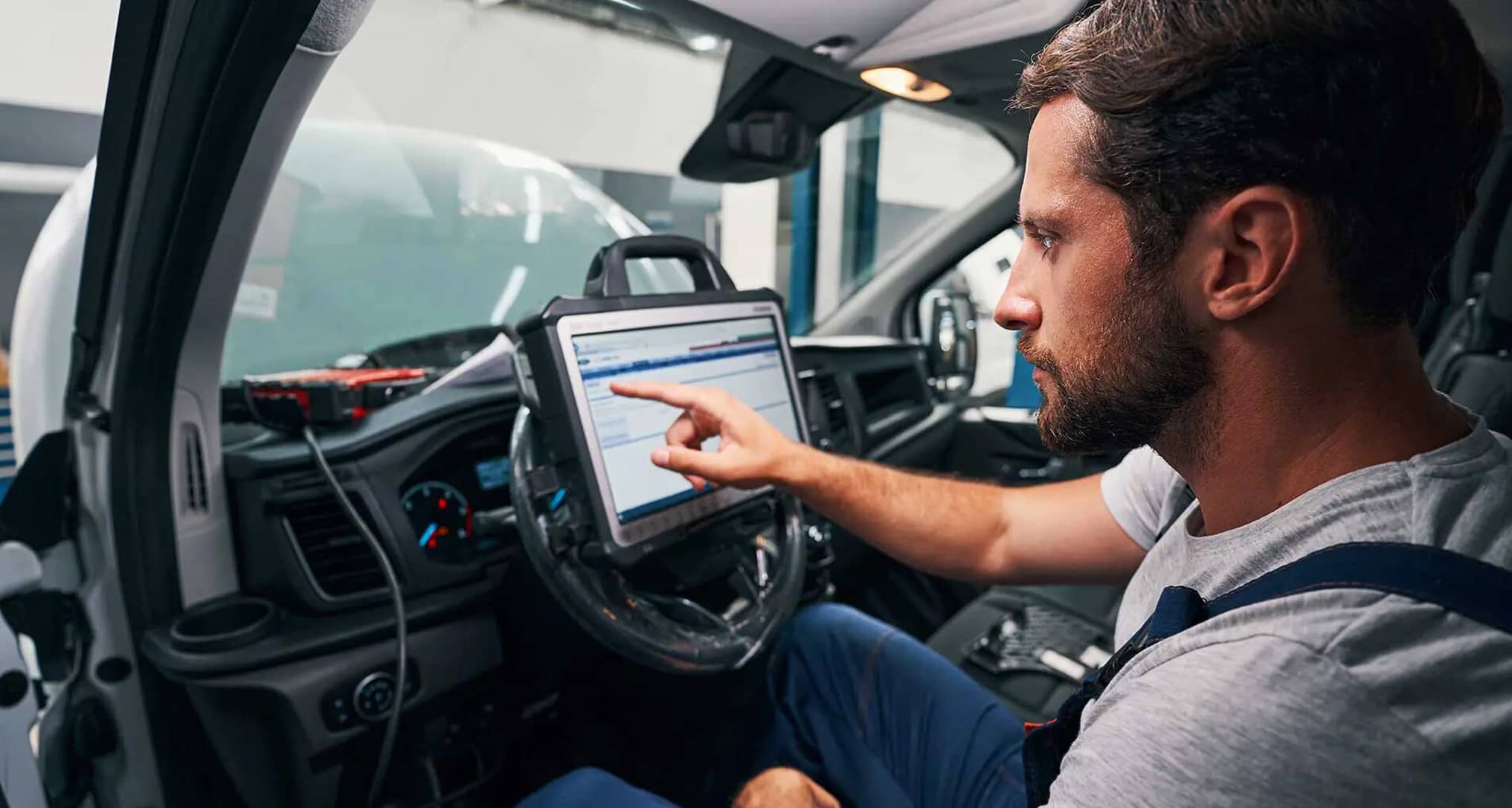 Man getting training on diagnostic tools