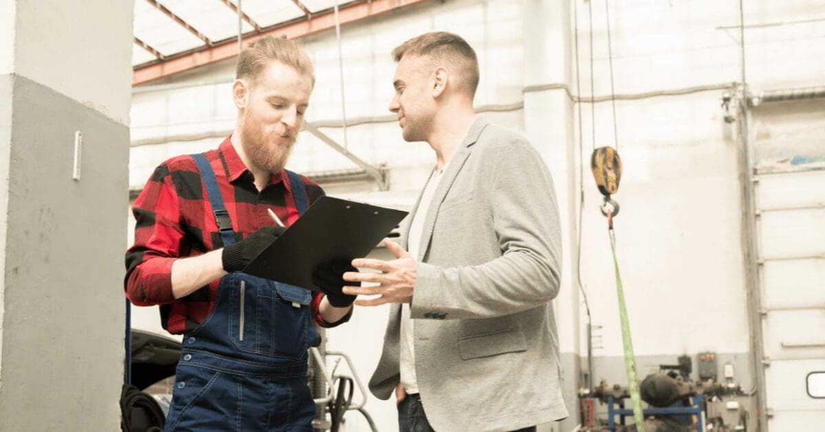 Tech manager going over cars scan results