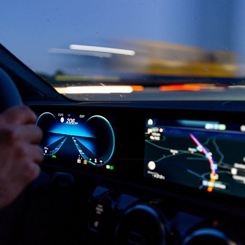 car dashboard lit up while driving