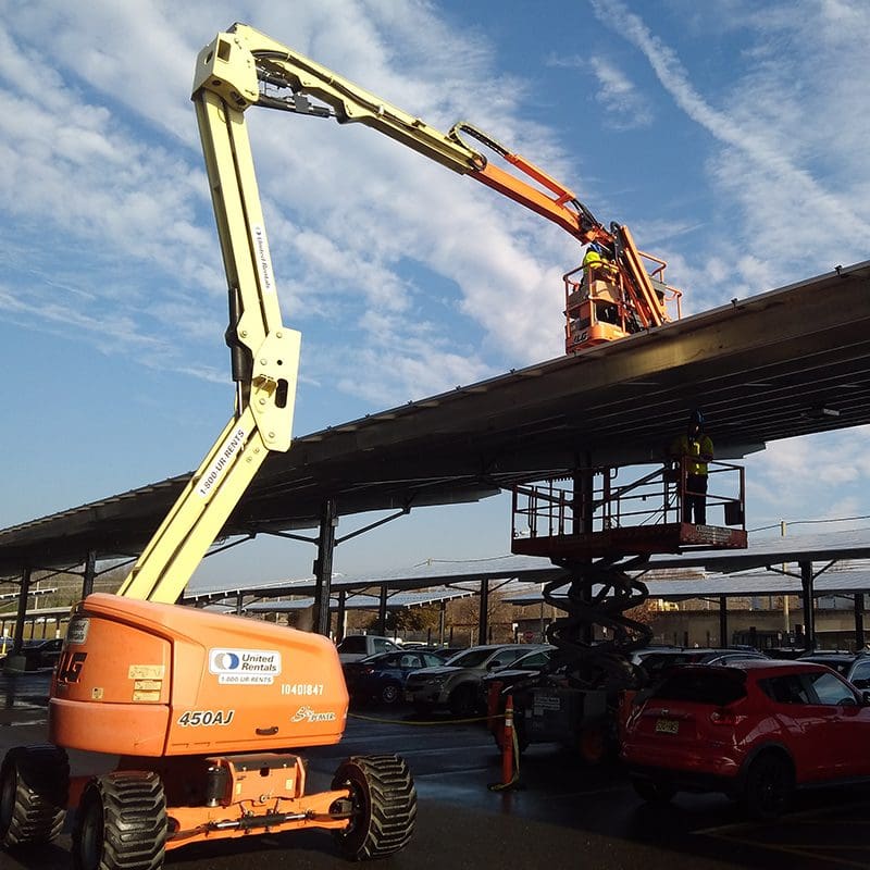 Construction workers on a boom lift Construction workers on a boom lift