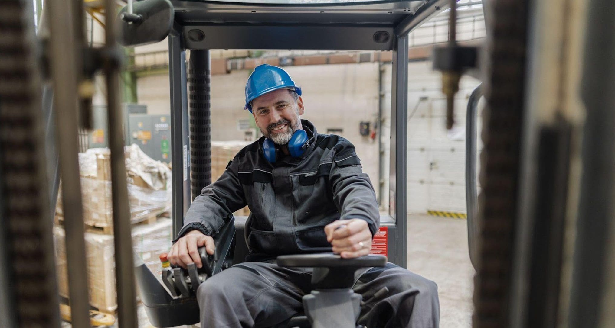 forklift driver moving product to semi truck