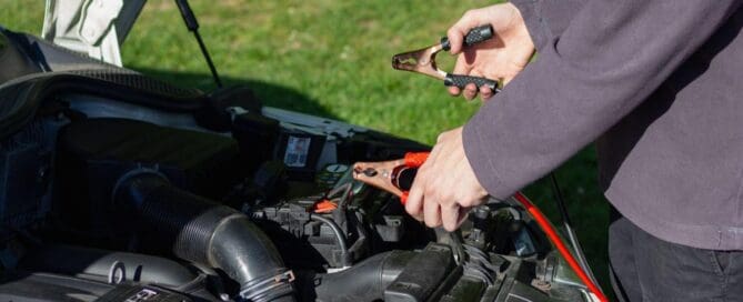 person jumping car battery