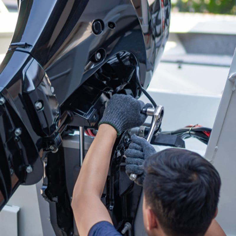 tech working on boat motor tech working on boat motor