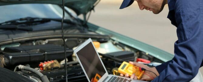 tech diagnosing sedan