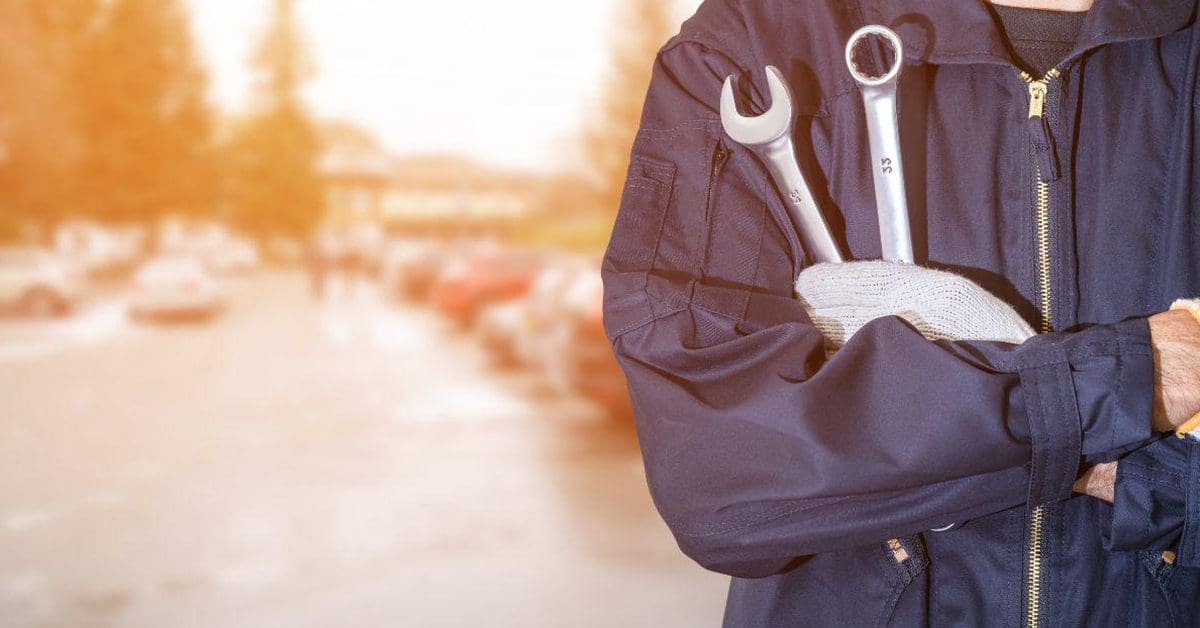 technician holding tools
