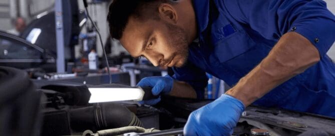 automotive diagnostic technician tightening engine head (1) (1)