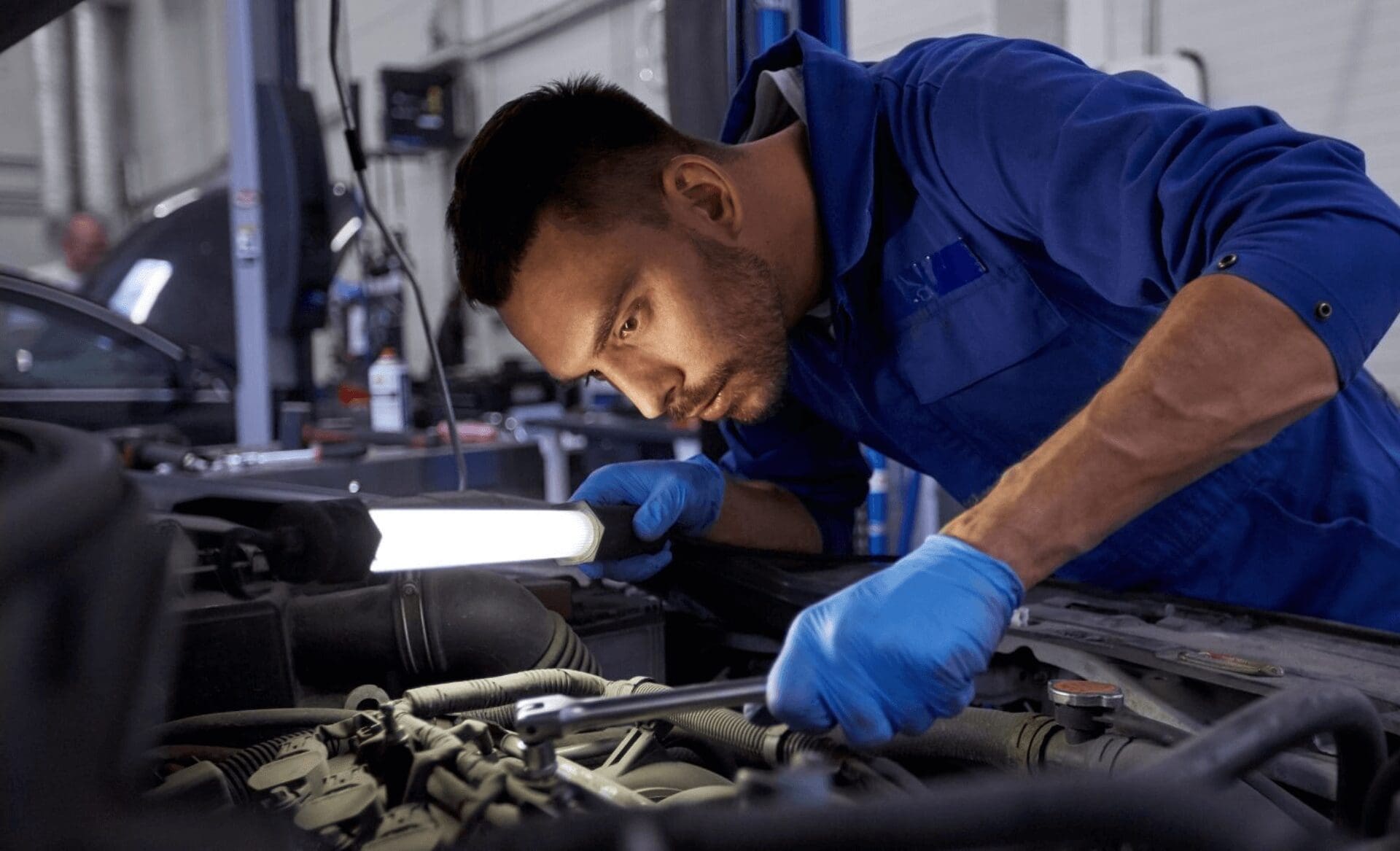 automotive diagnostic technician tightening engine head (1) (1)