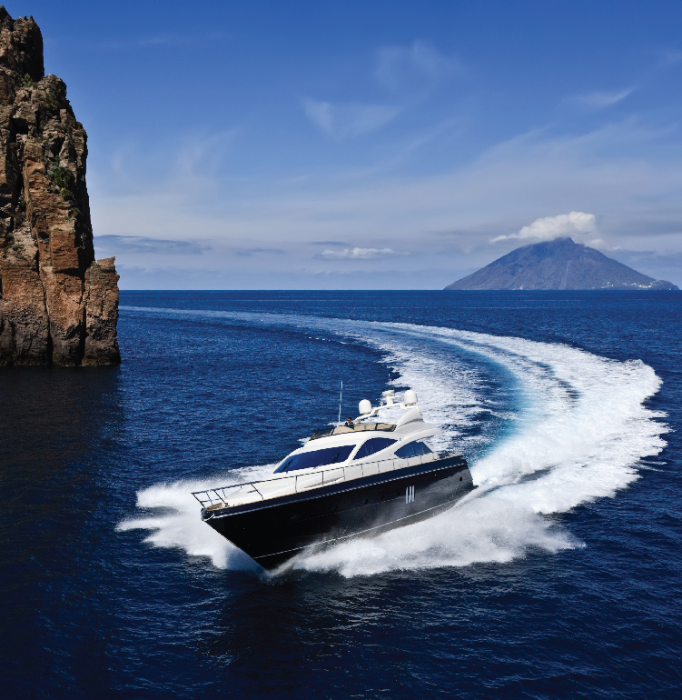 yacht in sicily going around rock