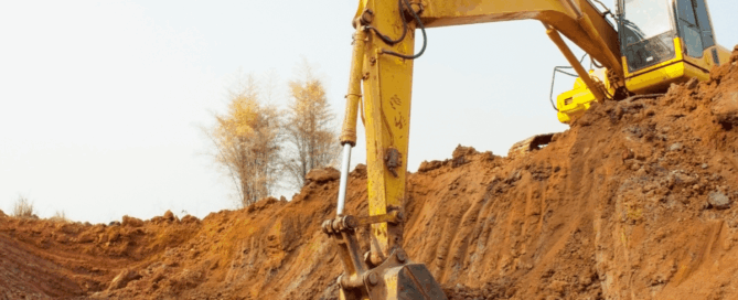 excavator digging up the ground for construction work
