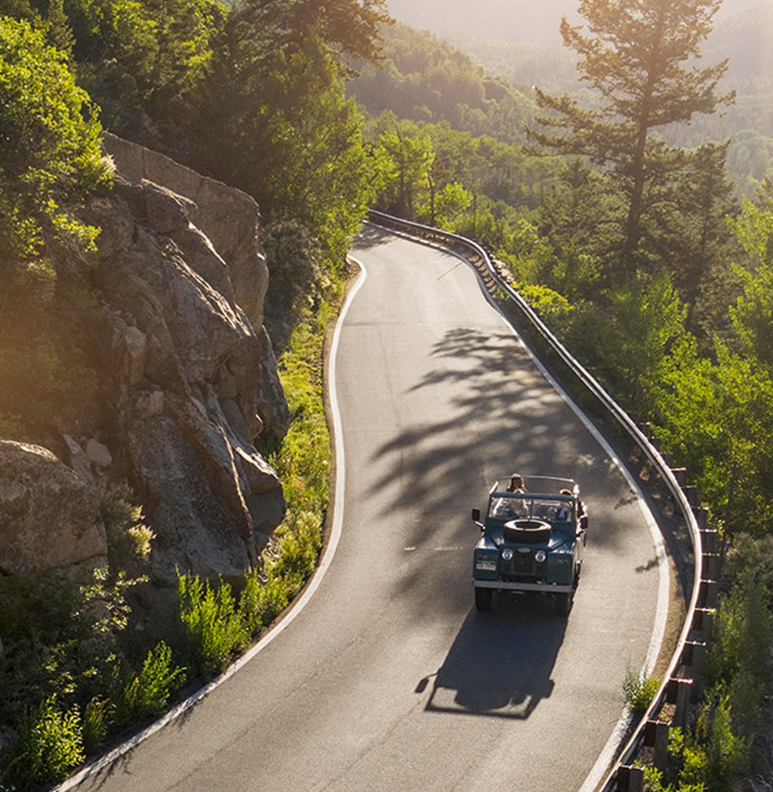landrover defender, driving on a mountian