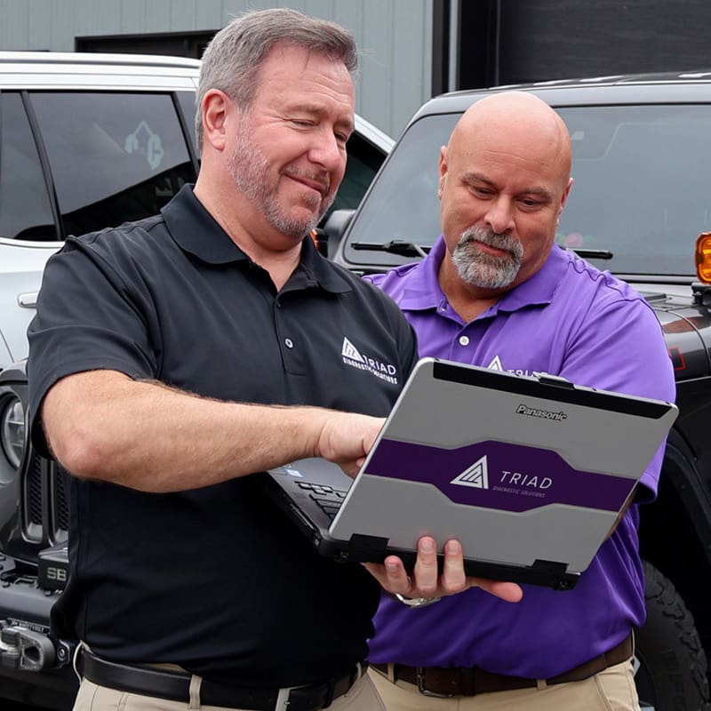 Bryan-and-Greg-looking at jaltest laptop