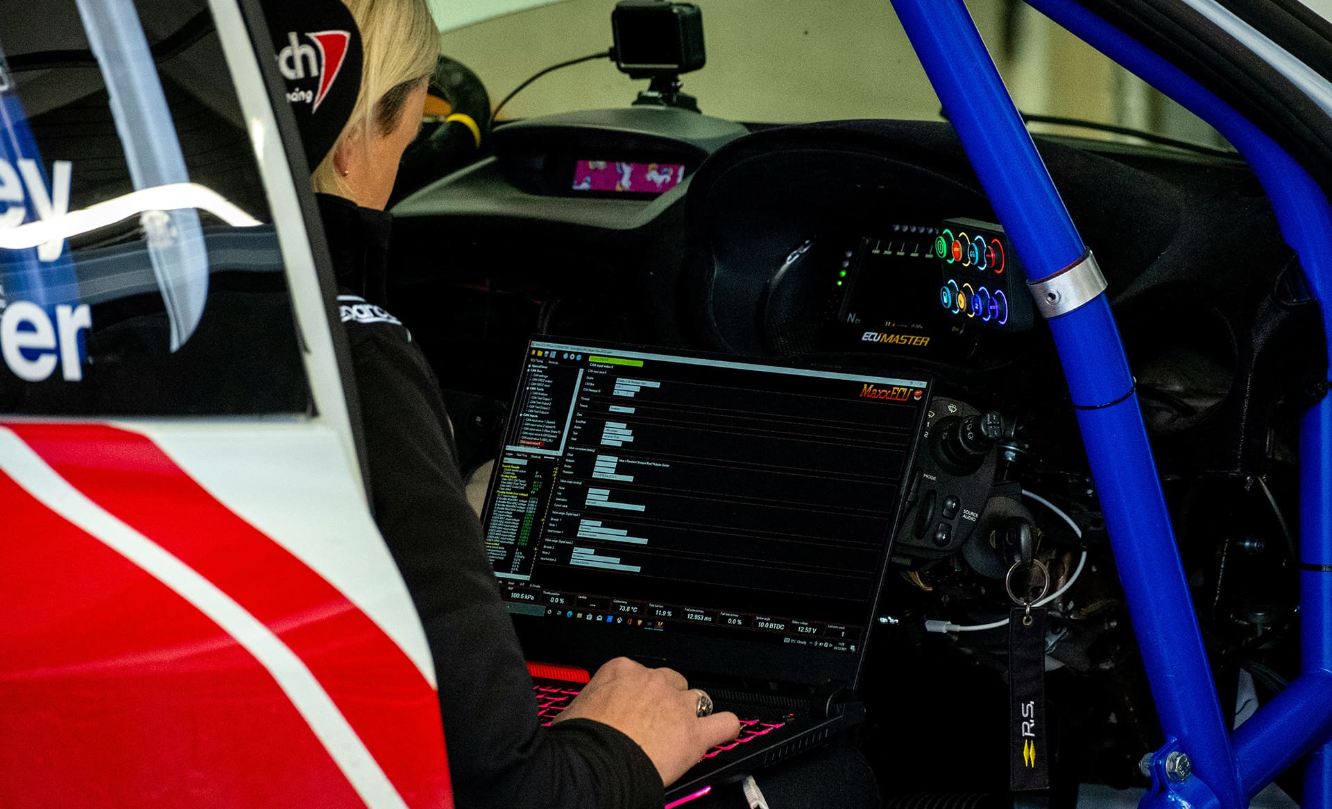 race car and diagnostic scan tool laptop