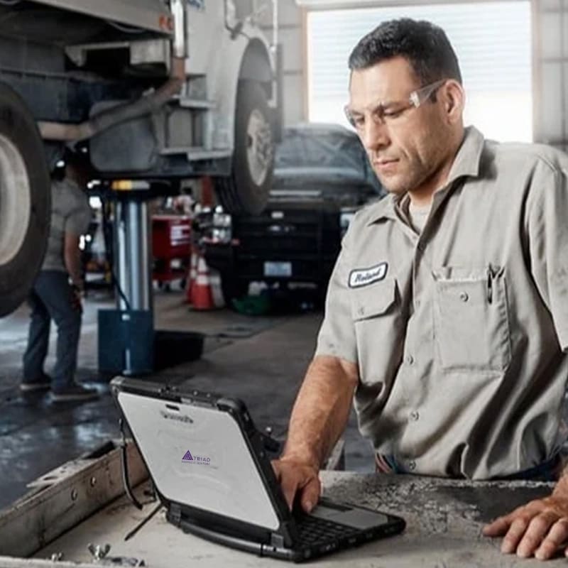 Panasonic-tech-with-toughbook-in-shop copy